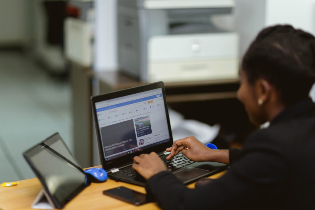 Woman typing on laptop